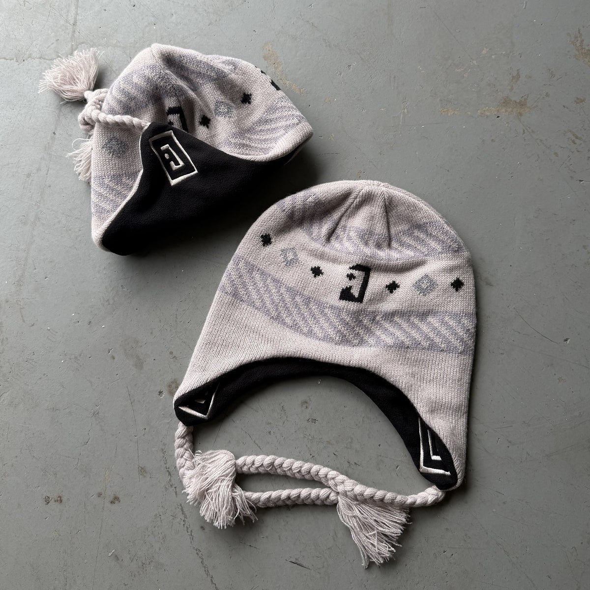 Sand Jabree Peruvian Earflap Beanie, flat lay with fleece-lined earflaps