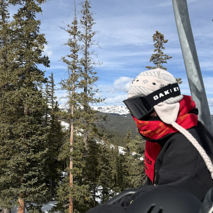 Sand Jabree Peruvian Earflap Beanie under goggles on a chairlift
